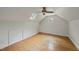 Attic bedroom with hardwood floors, skylight and a round window at 927 Jones Wynd, Wake Forest, NC 27587