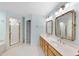 Bright bathroom featuring a double vanity, tile floors, and a separate shower at 927 Jones Wynd, Wake Forest, NC 27587