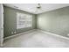 Carpeted bedroom with a ceiling fan and a bright window at 927 Jones Wynd, Wake Forest, NC 27587