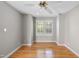 Light-filled bedroom with hardwood floors, neutral walls, and a ceiling fan at 927 Jones Wynd, Wake Forest, NC 27587