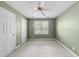 Green bedroom with carpet, a ceiling fan, and a window at 927 Jones Wynd, Wake Forest, NC 27587