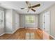 Spacious bedroom featuring hardwood floors and neutral walls, bathed in natural light at 927 Jones Wynd, Wake Forest, NC 27587