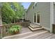 Exterior view of the deck, stairs to the yard, and exterior of the home at 927 Jones Wynd, Wake Forest, NC 27587