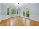 Dining room boasts hardwood floors, a chandelier, and natural light at 927 Jones Wynd, Wake Forest, NC 27587