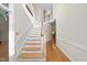 Bright foyer features hardwood floors and a staircase leading to the upper level at 927 Jones Wynd, Wake Forest, NC 27587
