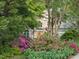 Charming home exterior surrounded by colorful azaleas and manicured landscaping in a desirable neighborhood at 927 Jones Wynd, Wake Forest, NC 27587