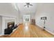 Living room features hardwood floors, fireplace and an open layout at 927 Jones Wynd, Wake Forest, NC 27587