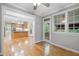 Living room with hardwood floors and many windows at 927 Jones Wynd, Wake Forest, NC 27587
