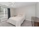 Bright bedroom featuring a large window and neutral decor at 1003 Red Sunset Dr, Apex, NC 27502