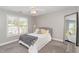 Bright bedroom with a cozy bed, ceiling fan, and window view at 1003 Red Sunset Dr, Apex, NC 27502