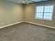 Neutral bedroom with a large window providing ample natural light at 1003 Red Sunset Dr, Apex, NC 27502