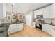 Well-equipped kitchen with island, stainless appliances, and a breakfast area with backyard views at 1003 Red Sunset Dr, Apex, NC 27502
