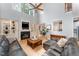 Spacious living room with fireplace, built-in bookshelves and clear view to dining area at 1003 Red Sunset Dr, Apex, NC 27502
