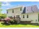 Exterior of home featuring a deck and lush backyard landscaping at 1007 Grandover Dr, Durham, NC 27713