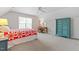 Spacious bedroom features a teal wardrobe, desk and window with natural light at 1007 Grandover Dr, Durham, NC 27713