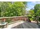 Wooden deck with plants and trees in the backyard at 1007 Grandover Dr, Durham, NC 27713