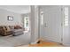 Inviting entryway with hardwood floors leading to a cozy living room with natural light at 1007 Grandover Dr, Durham, NC 27713