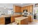 Well-equipped kitchen with sleek appliances and an attached eat-in dining area at 1007 Grandover Dr, Durham, NC 27713