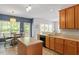 Bright eat-in kitchen featuring an island and a door to the outside at 1007 Grandover Dr, Durham, NC 27713