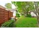 A nicely landscaped yard with privacy fence and mature shade trees at 102 Fairgrove Way Way, Cary, NC 27511