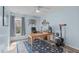 Bedroom with wood-look floors, blue walls, a ceiling fan, a desk and a rug at 102 Fairgrove Way Way, Cary, NC 27511
