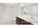 Bathroom featuring a shower/tub combo and dual sink vanity with wood cabinets at 104 S Buggy Dr # 71P, Benson, NC 27504