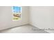A photo of a bedroom with carpeted floors and a window at 104 S Buggy Dr # 71P, Benson, NC 27504