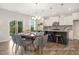 Eat-in kitchen with stainless steel appliances, pendant lighting, and an adjacent dining area at 104 S Buggy Dr # 71P, Benson, NC 27504