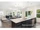 Open-concept kitchen and dining area featuring a large island and stainless steel appliances at 104 S Buggy Dr # 71P, Benson, NC 27504