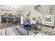 Open-concept living space connecting the kitchen, dining area, and living room with stylish furnishings at 104 S Buggy Dr # 71P, Benson, NC 27504