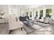 Bright living room featuring stylish decor, neutral colors, and large windows for ample natural light at 104 S Buggy Dr # 71P, Benson, NC 27504