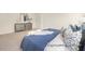A view of the spacious main bedroom showing the bed with a decorative dresser in the background at 104 S Buggy Dr # 71P, Benson, NC 27504