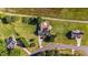 Expansive aerial view of a home showcasing a backyard pool, solar panels, and lush landscaping at 106 Contender Dr, Clayton, NC 27520
