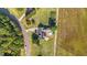 Expansive aerial view of a home showcasing a backyard pool, solar panels, and lush landscaping at 106 Contender Dr, Clayton, NC 27520
