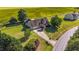 Aerial view of home with a spacious lot, mature trees, well-manicured lawn, and a long driveway at 106 Contender Dr, Clayton, NC 27520