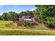 Backyard with fence, deck, solar panels, and a view of the green space at 106 Contender Dr, Clayton, NC 27520