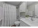 Well-lit bathroom featuring a shower/tub combo and a large vanity with storage at 106 Contender Dr, Clayton, NC 27520