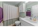 Bathroom with shower, toilet, sink, cabinet, and a framed piece of artwork creates a fresh feel at 106 Contender Dr, Clayton, NC 27520