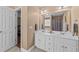 Bright bathroom features double sink vanity and a view to the bedroom at 106 Contender Dr, Clayton, NC 27520