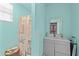 Bright bathroom features a shower/tub combo, sink, and a beach-themed curtain, offering relaxation at 106 Contender Dr, Clayton, NC 27520
