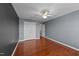 Bedroom features hardwood floors, ceiling fan, and gray walls at 106 Contender Dr, Clayton, NC 27520
