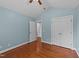 Light-filled bedroom featuring hardwood floors, and a vaulted ceiling at 106 Contender Dr, Clayton, NC 27520