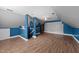This bonus room has custom wood paneling, wood floors, and light blue and gray paint at 106 Contender Dr, Clayton, NC 27520