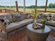 Relaxing deck area with comfortable seating and a scenic view of the surrounding countryside at 106 Contender Dr, Clayton, NC 27520
