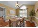 Bright dining room with elegant table settings, a vaulted ceiling, and ample natural light at 106 Contender Dr, Clayton, NC 27520