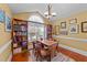 A dining room is brightened by a window with decor and a table with four chairs at 106 Contender Dr, Clayton, NC 27520