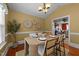 Cozy dining room featuring hardwood floors and seamless access to the kitchen at 106 Contender Dr, Clayton, NC 27520