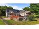 Backyard with an above ground pool, wooden deck, and solar panels on the roof at 106 Contender Dr, Clayton, NC 27520