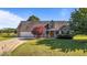 Beautiful home with a manicured lawn, mature trees, a two-car garage, and a welcoming front porch at 106 Contender Dr, Clayton, NC 27520