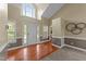 Inviting foyer with soaring ceiling, hardwood floors, wainscoting, and a large front door at 106 Contender Dr, Clayton, NC 27520